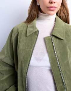 Model wearing Faux suede zip through seam detail jacket in green