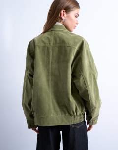 Model wearing Faux suede zip through seam detail jacket in green