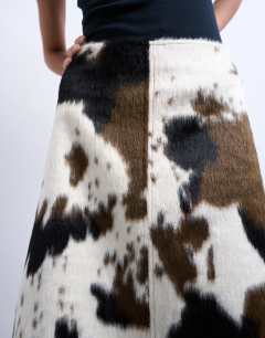 Model wearing Fax fur pony skin a-line midi skirt in cow print