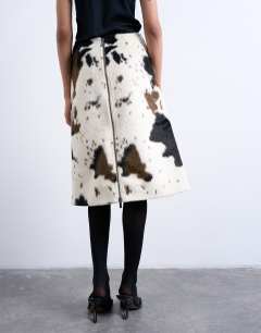 Model wearing Fax fur pony skin a-line midi skirt in cow print