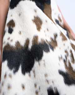 Model wearing Fax fur pony skin a-line midi skirt in cow print