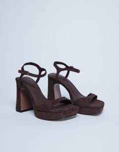 Model wearing Faye chunky platform heeled sandal in chocolate