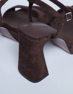 Model wearing Faye chunky platform heeled sandal in chocolate
