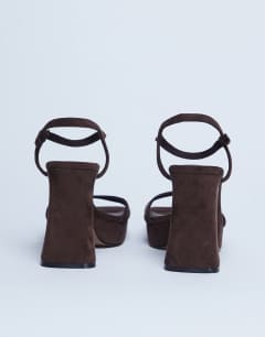 Model wearing Faye chunky platform heeled sandal in chocolate