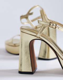 Model wearing Faye platform two part sandal in gold