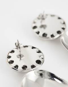 Model wearing Faye stud drop earrings in silver
