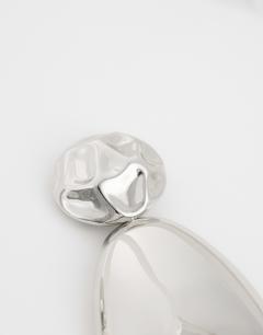 Model wearing Faye stud drop earrings in silver