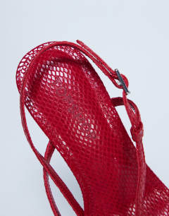 Model wearing Felicity strappy high heeled sandal in red snake