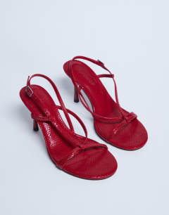 Model wearing Felicity strappy high heeled sandal in red snake