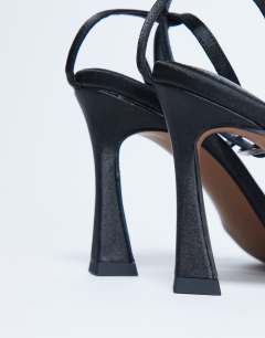 Model wearing Fifi embellished flare heel sandal in black