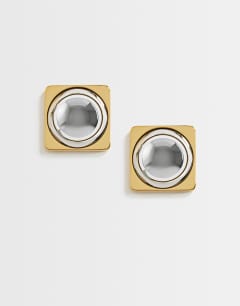 Model wearing Fifi waterproof stainless steel stud 2 tone earrings in silver and gold