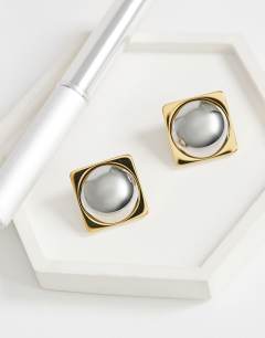 Model wearing Fifi waterproof stainless steel stud 2 tone earrings in silver and gold
