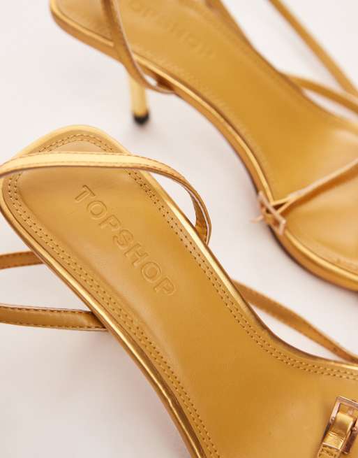 Gold barely fashion there mid heel sandals