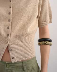 Model wearing Fine knitted cinch waist polo in oat