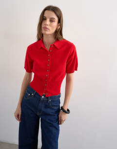 Model wearing Fine knitted short sleeve cinch waist polo in red