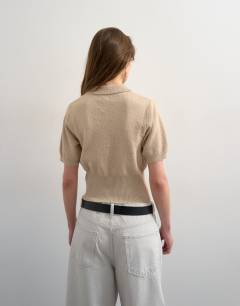 Model wearing Fine knitted towelling cinch waist polo in oat