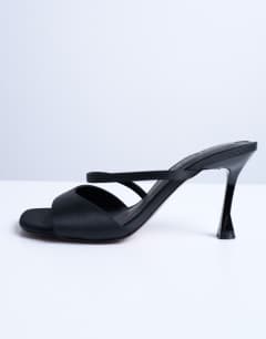 Model wearing Fiona high heel mule with strap in black