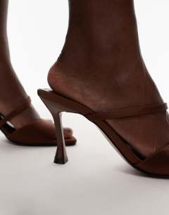 Model wearing Fiona high heel mule with strap in brown