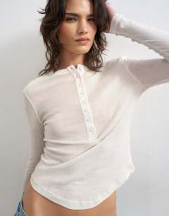 Model wearing Fitted long sleeve henley in ecru