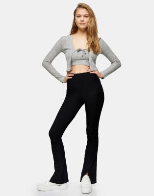 Topshop - Flare-broek met split aan de voorkant in zwart | ASOS