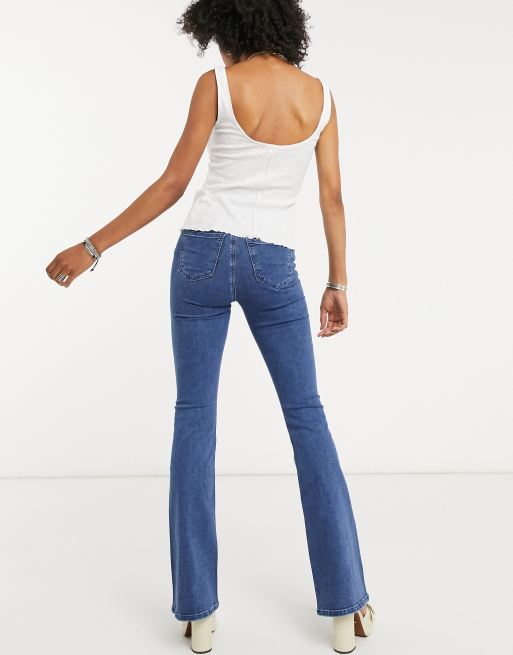 Topshop flare jeans in mid wash blue | ASOS