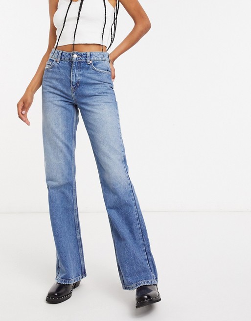 Topshop flared jeans in mid wash blue | ASOS
