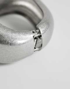 Model wearing Flavia chunky bangle in silver