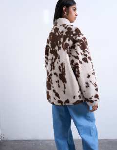 Model wearing Fleece borg jacket in cow print