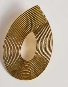 Model wearing Flick stud earring in gold