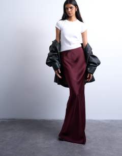 Model wearing Flood length maxi bias skirt in burgundy