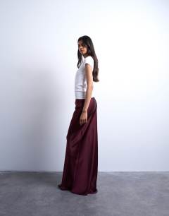 Model wearing Flood length maxi bias skirt in burgundy