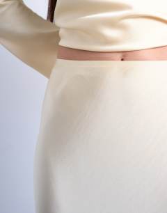 Model wearing Flood length maxi bias skirt in buttermilk