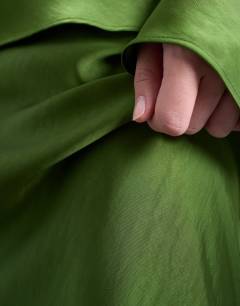 Model wearing Flood length maxi bias skirt in green