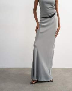 Model wearing Flood length satin bias maxi skirt in grey