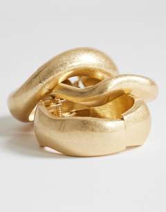 Model wearing Flora 3 pack bangles in gold tone