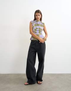Model wearing Floral printed drape back top in purple