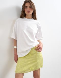 Model wearing Floral sequin mini skirt with tie sides in yellow