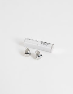 Model wearing Flossie stainless steel earring in silver