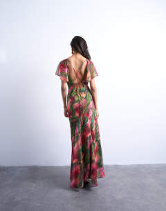 Model wearing Flutter sleeve godet hem midi dress in blurred floral