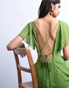 Model wearing Flutter sleeve godet hem midi dress in green