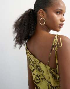 Model wearing Fold over bust maxi occasion dress in paisley floral