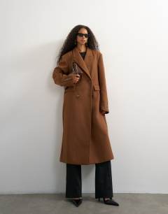 Model wearing Formal double breasted longline coat in toffee
