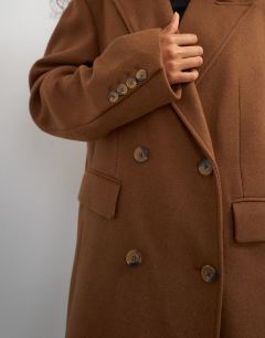 Model wearing Formal double breasted longline coat in toffee