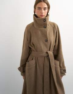 Model wearing Formal long trench jacket in mocha