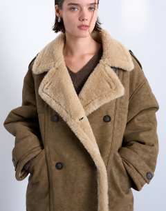 Model wearing Formal longline shearling coat in khaki
