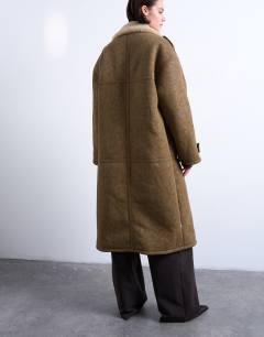 Model wearing Formal longline shearling coat in khaki