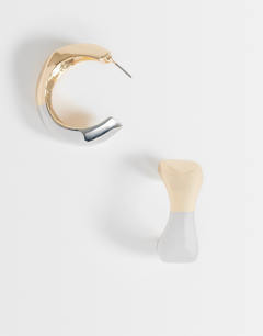 Model wearing Foster two tone hoop earring in gold and silver