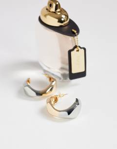 Model wearing Foster two tone hoop earring in gold and silver