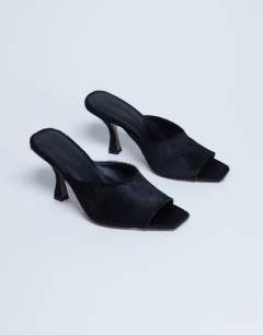 Model wearing Fox heeled mule in black hair on real leather
