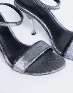 Model wearing Fran real leather pony with metal high heel in silver pony